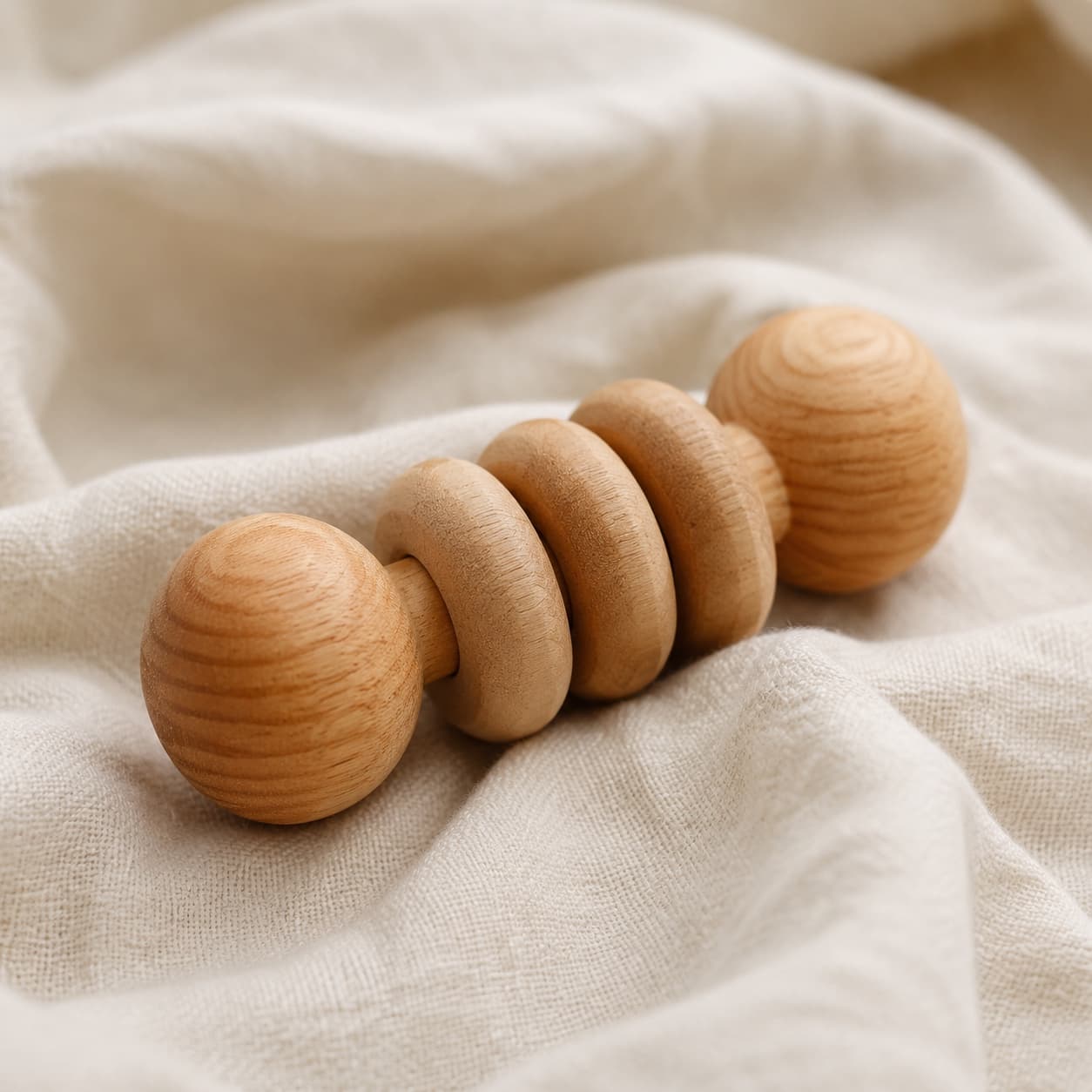 Wooden chew toy on linen